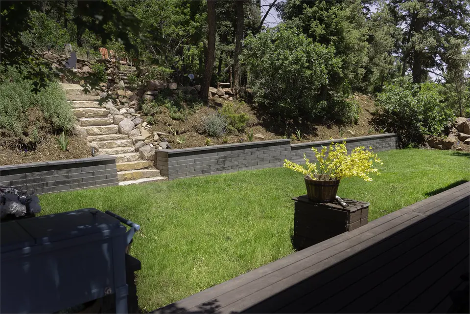 Lawn, retaining wall and stone steps
