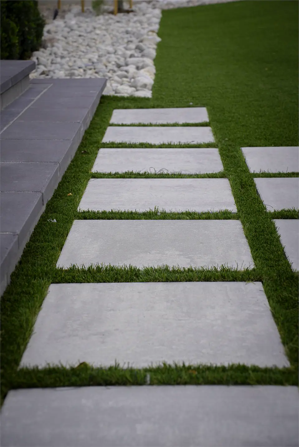 Square pavers set in turf